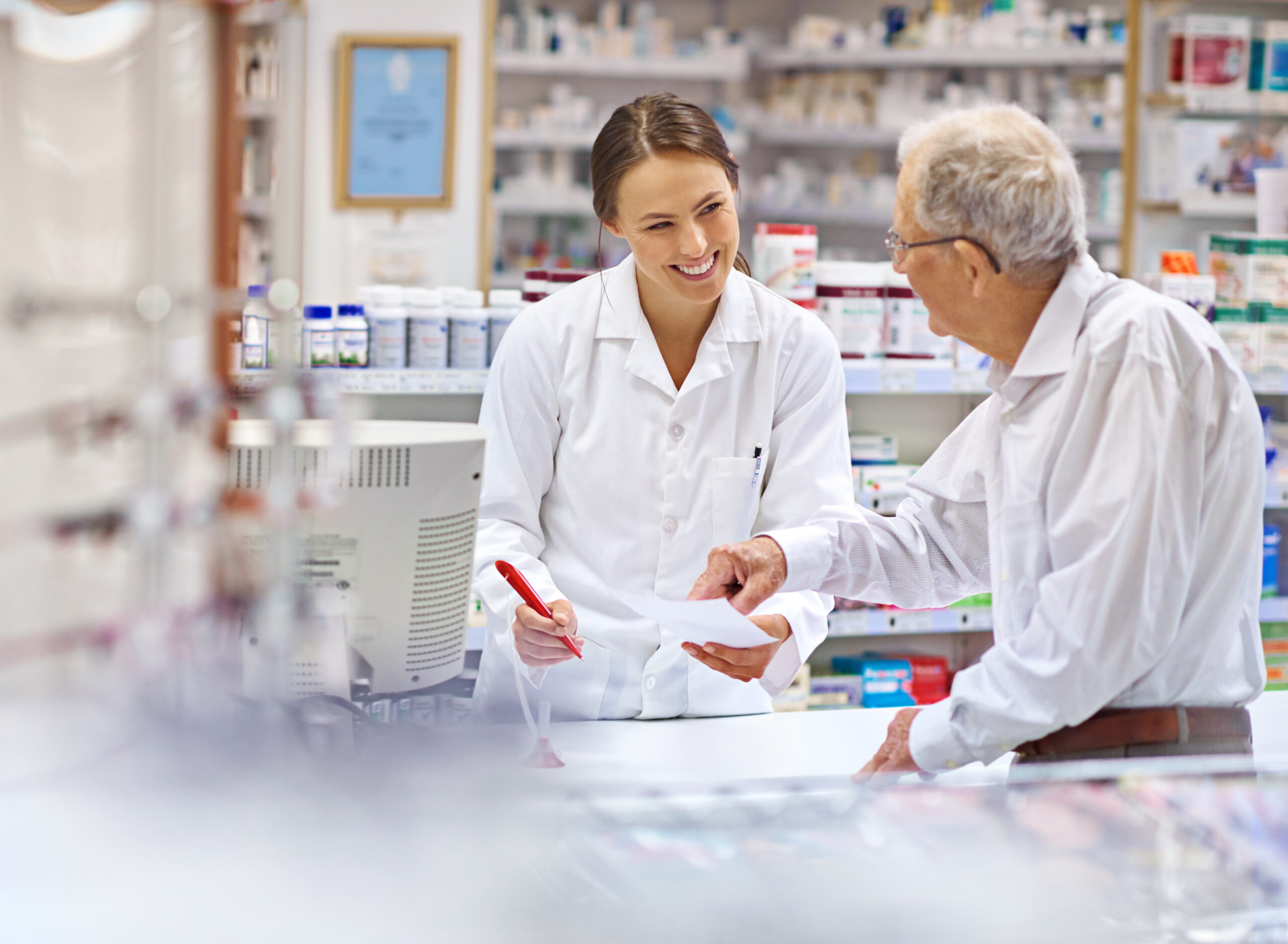 Pharmacy First Service Image A lady talking to an older man scaled