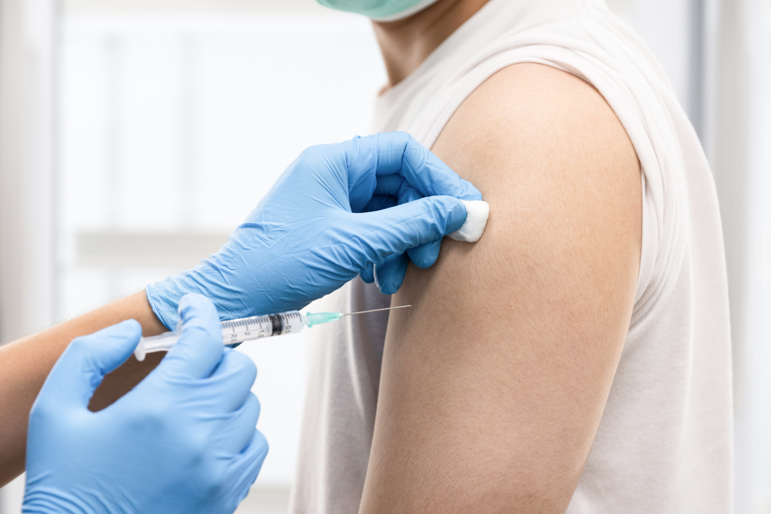 a person having a covid 19 injection scaled